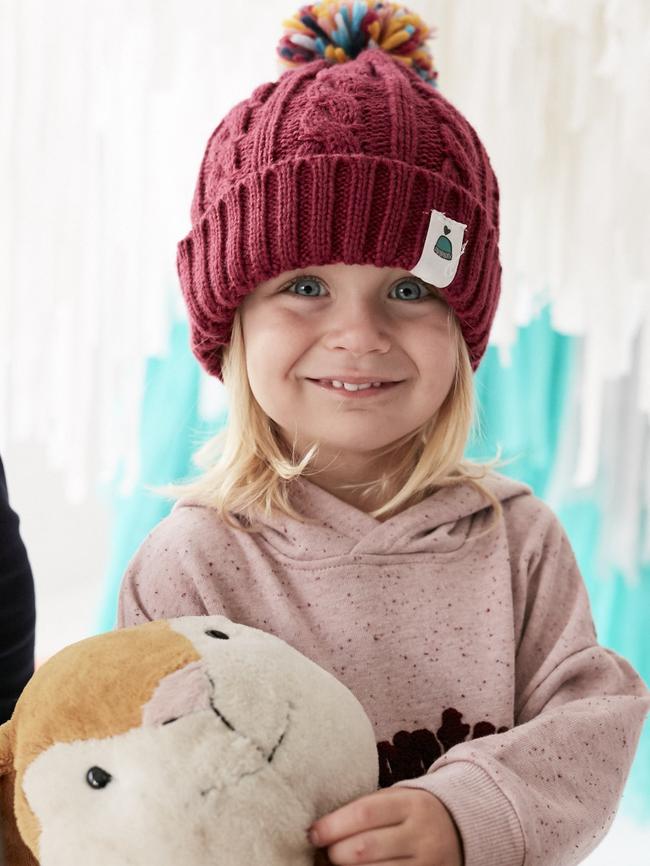 Evie shows off her Beanies 4 Brain cancer hat.