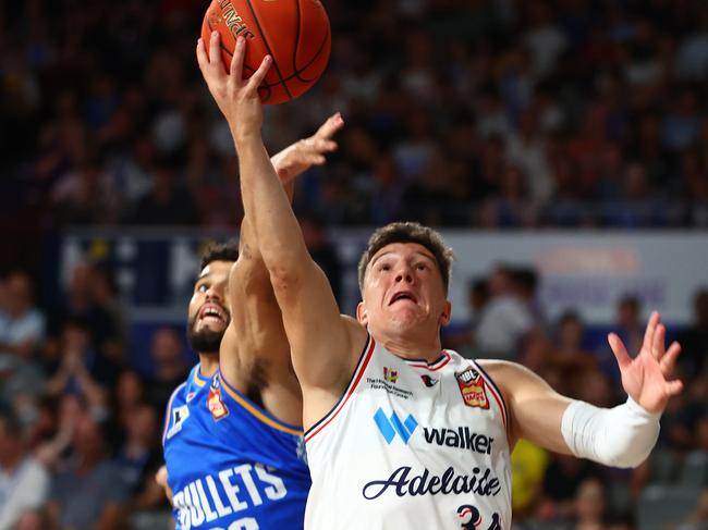 Dejan Vasiljevic and Sam McDaniel contest the ball. Picture: Chris Hyde/Getty Images