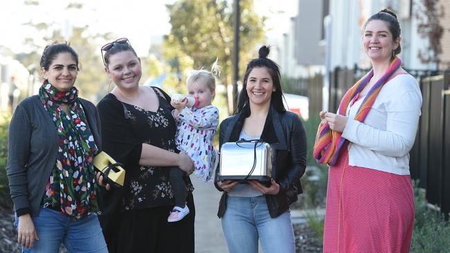 Nerina Papanastasiou, left, with Cassandra Chapple and baby, Raquel Cutajar and Angela Rule, building community through a Facebook group. Picture: David Smith