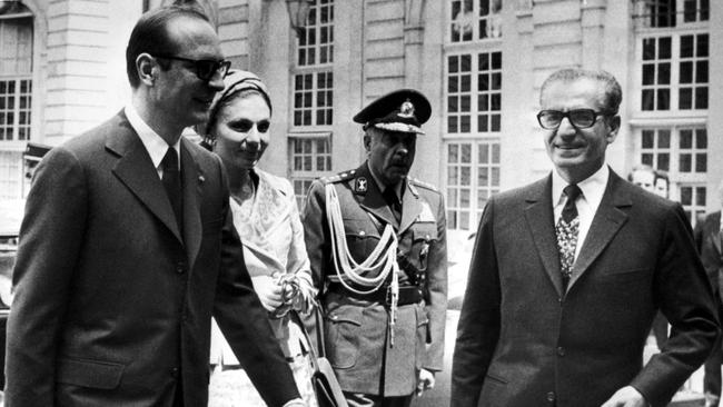 Mohammad Reza Pahlavi, right, and his wife Farah Diba are welcome by French Prime Minister Jacques Chirac to Paris in 1974. Picture: AFP)