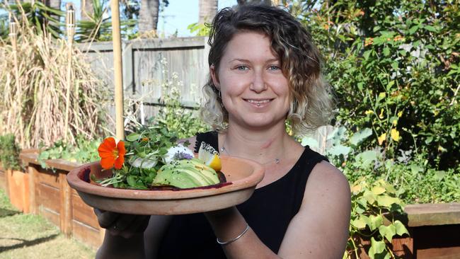 Marie James with House made turmeric bread, free range eggs, sauteed organic greens, avocado, organic living sprout medley (GF, DF). Photo by Richard Gosling