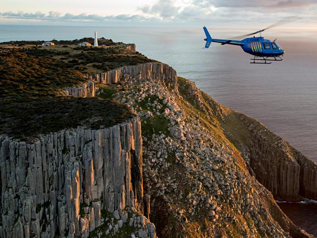 Rotorlift helicopter on an excursion to Tasman Island. Picture: Richard Bennet