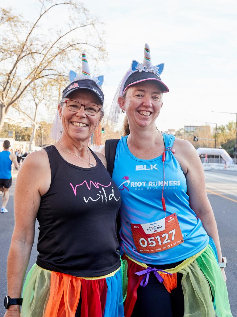 Kerry Madigan and Jennifer Saville pose for a picture in Adelaide, before the start of the 12km run in the City to Bay, Sunday, Sept. 15, 2019. Picture: MATT LOXTON