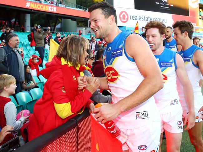 SYDNEY, AUSTRALIA - JULY 21: Steven May of the Suns and his team mates celebrate victory with their supporters after the round 18 AFL match between the Sydney Swans and the Gold Coast Suns at Sydney Cricket Ground on July 21, 2018 in Sydney, Australia. (Photo by Mark Kolbe/Getty Images)