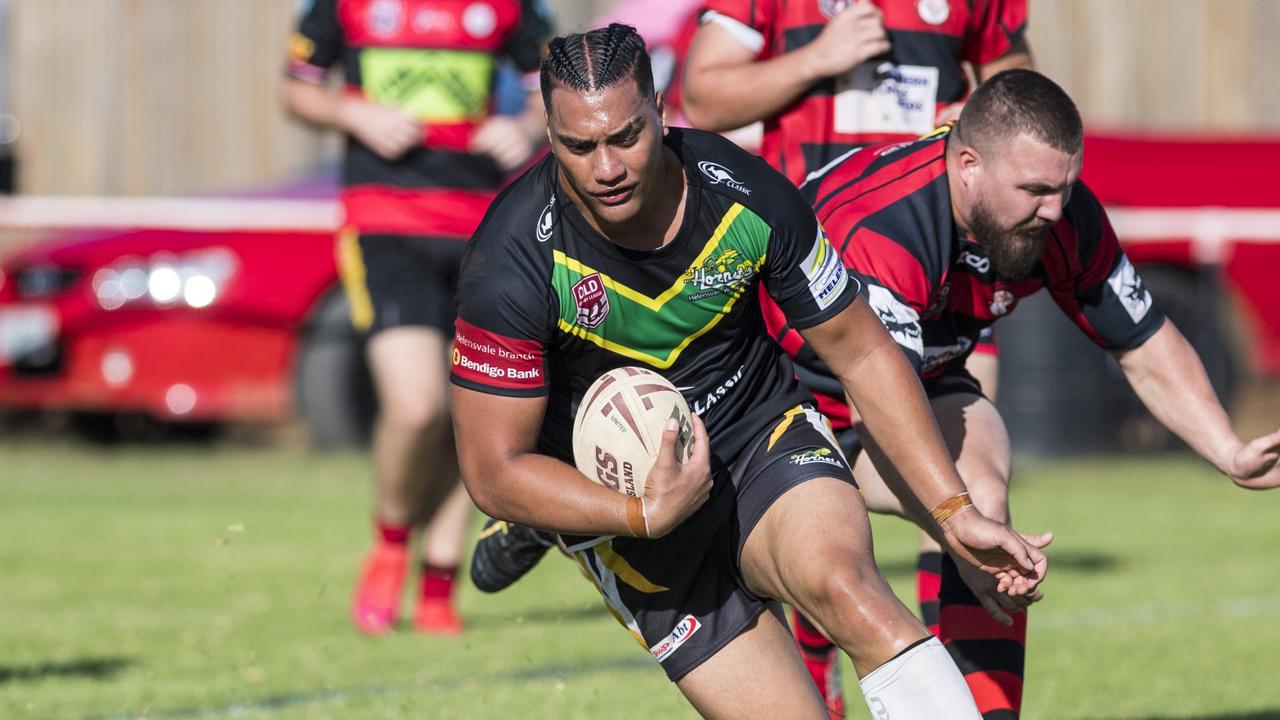 Liam Clark goes over for a Helensvale try. Picture: Kevin Farmer