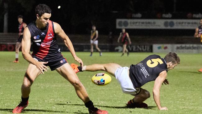 West Adelaide's Thomas Keough and Glenelg's Christ Curran chase possession at Richmond Oval. Picture: Matt Loxton