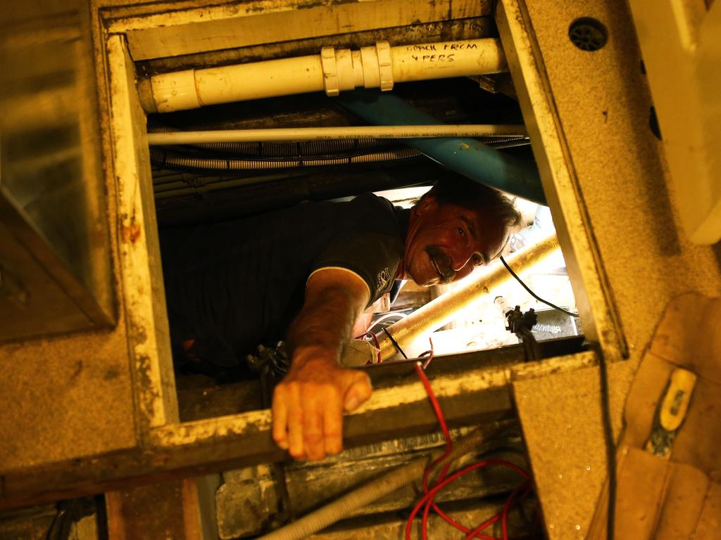 Endeavour dry dock in progress Ð Volunteer Stephen Schmidt changing transducer from inside. Endeavour undergoing renovations at the Sydney City Marine dry dock in Rozelle, under the ANZAC bridge.