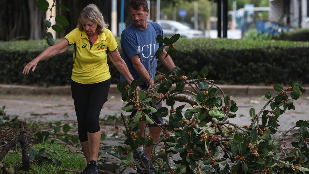 The clean-up begins along The Strand in Townsville. Picture: Adam Head