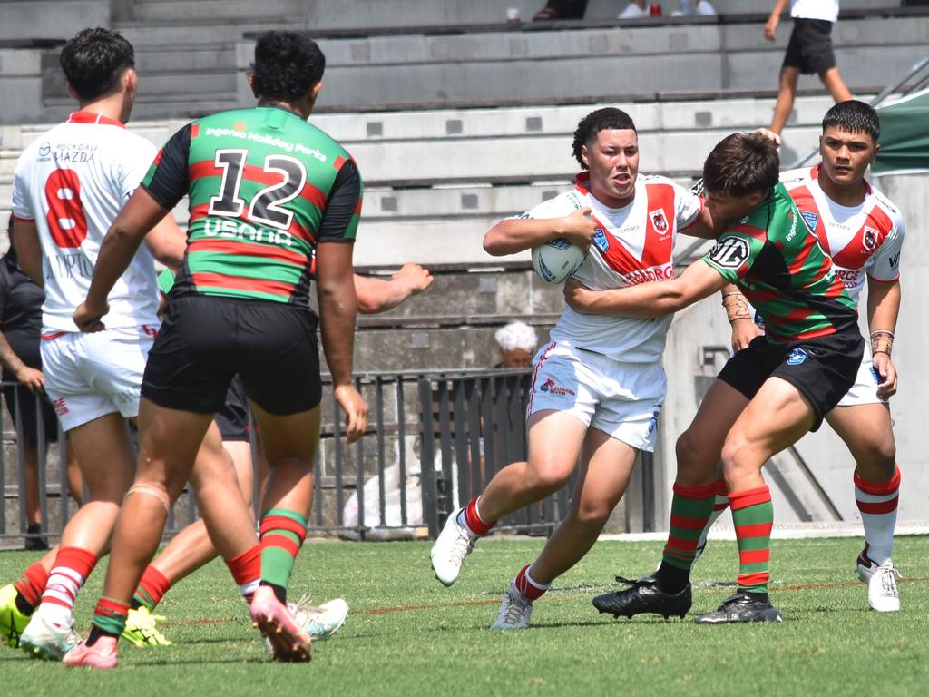 Jaeden Kavana is tackled by Benjamin Kaberry. Picture: Sean Teuma