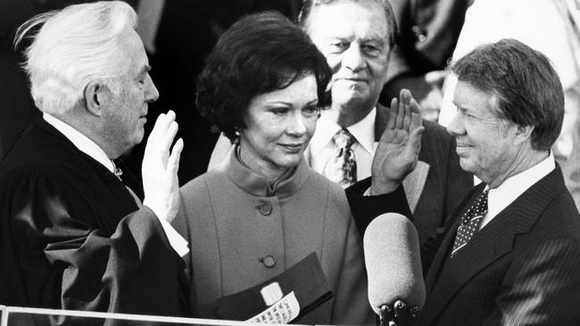 Chief Justice Warren Burger administers the oath of office to Carter as the 39th US president in 1977. Picture: AFP