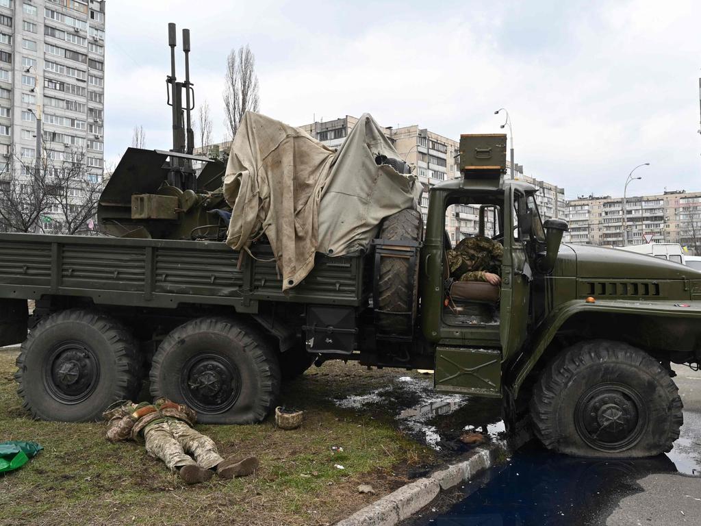 Bloody battle. Bodies beside a vehicle after they were shot during a battle in the Ukrainian capital of Kyiv. Picture: AFP