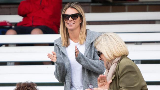 Warner’s wife, Candice Falzon, watches her husband during his grade cricket match. Picture: Luke Drew