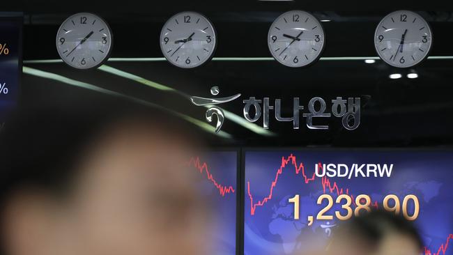 Traders in a foreign exchange dealing room in Seoul. Picture: AP