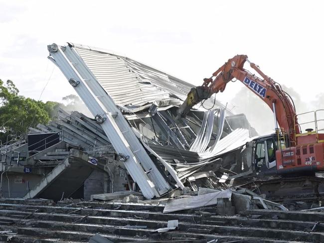 Over it goes ... The famed stadium now a wreckage.