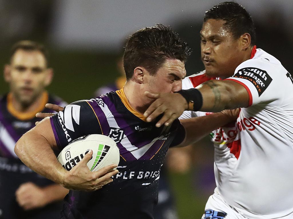 WOLLONGONG, AUSTRALIA - JULY 04: Brodie Croft of the Storm hands off Luciano Leila of the Dragons during the round 16 NRL match between the St George Illawarra Dragons and the Melbourne Storm at WIN Stadium on July 04, 2019 in Wollongong, Australia. (Photo by Mark Metcalfe/Getty Images)