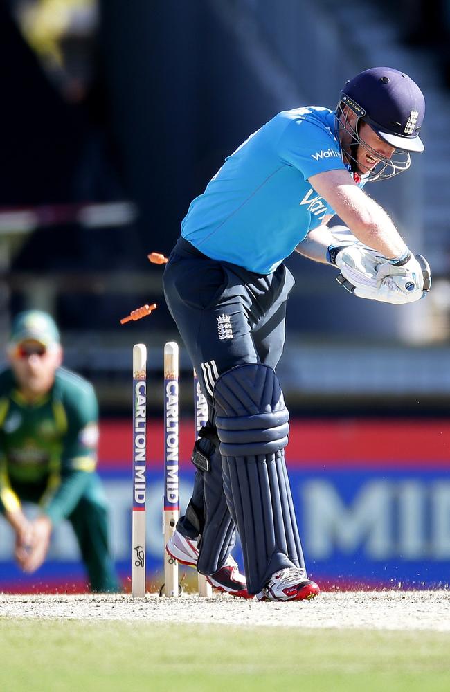 Eoin Morgan is bowled by Mitchell Johnson during the tri-series final after leaving the ball.