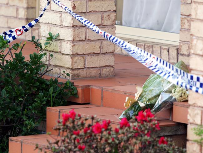 Flowers left outside the Lin family house in North Epping after the murders on July 18, 2009.