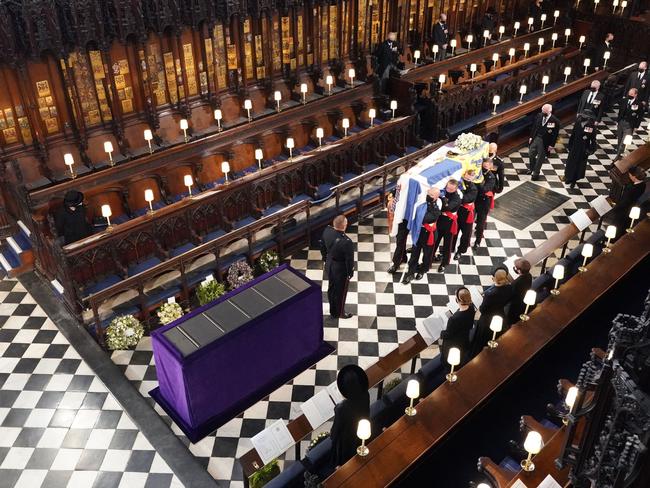 Queen Elizabeth II watches as pallbearers carry the coffin of Prince Philip, Duke of Edinburgh. Picture: Dominic Lipinski / POOL / AFP