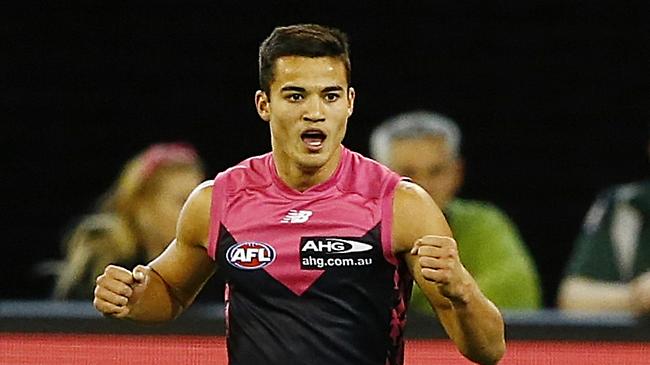 Billy Stretch celebrates kicking a goal in his first game for the Demons.