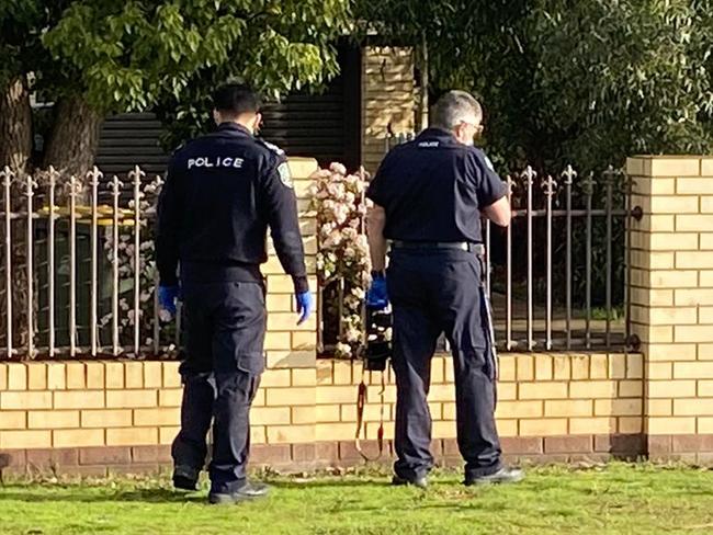 Police return to the scene of a shooting at Munno Para West.