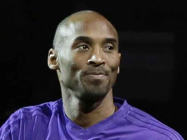 Los Angeles Lakers forward Kobe Bryant acknowledges the fans during player introductions of an NBA basketball game against the Detroit Pistons, Sunday, Dec. 6, 2015, in Auburn Hills, Mich. (AP Photo/Carlos Osorio)