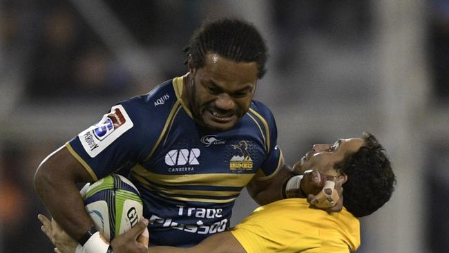 Brumbies winger Henry Speight is tackled by Jaguares fullback Joaquin Tuculet.