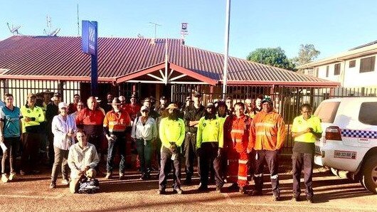 The search party poses for a photo outside the Aurukun police station. Picture: QPS