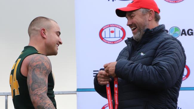 Kennedy receives his grand final best on ground medal from Tony Modra. Picture: Dos Photography