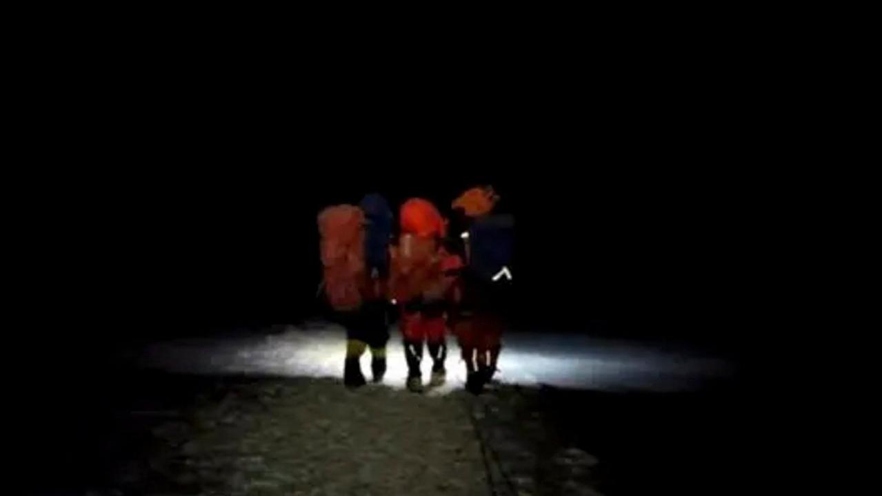 Fan Jiangtao and Xie Ruxiang were just 400 meters from the summit when they made the tough call to abandon their climb to rescue another climber. Picture: PKU