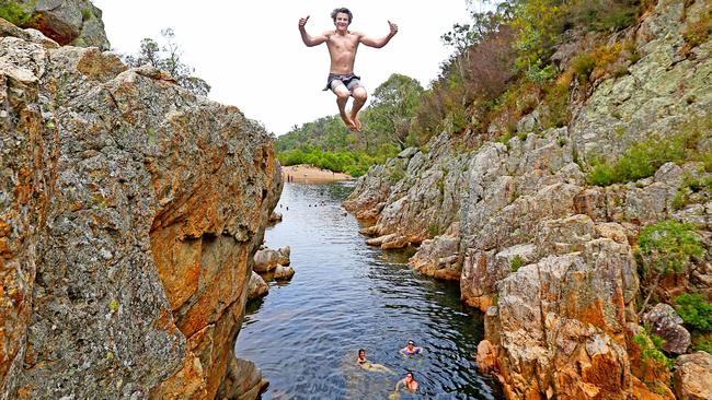 Jacob Lawless, 15 from Hazlewood jumps in the water at Blue Pool, Gippsland. Picture: Tim Carrafa