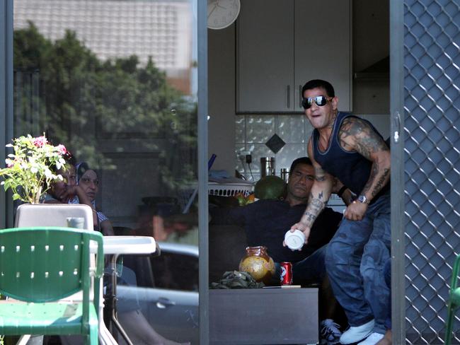 Sam Ibrahim at his mother’s Merrylands home with associate Tongan Sam. Sam Ibrahim was shot twice in the leg outside this house.