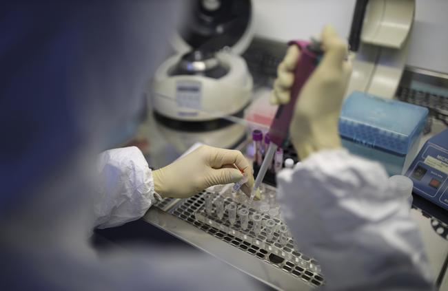 A medical staffer works with test systems for the diagnosis of coronavirus, at the Krasnodar Center for Hygiene and Epidemiology microbiology lab in Krasnodar, Russia. Picture: AP Photo