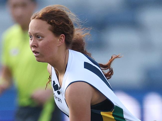 GEELONG, AUSTRALIA - AUGUST 31: Evie Cowcher of Team Morrison handballs whilst being tackled by Chloe Bown of Team Prespakis during the Marsh AFL National Futures Girls match between Team Morrison and Team Prespakis at GMHBA Stadium on August 31, 2024 in Geelong, Australia. (Photo by Daniel Pockett/AFL Photos/via Getty Images)