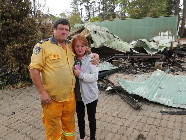 Rosemary Doyle surveys what’s left of her home on Railway Pde, Balmoral, supported by friend and RFS firefighter Peter Lawrence in Balmoral. Picture Rohan Kelly