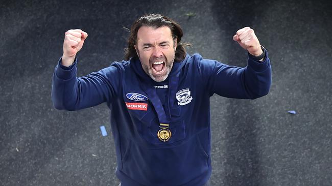 Chris Scott lets the emotion out as he walks down the race after the grand final. Picture: David Caird