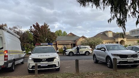 Police at the scene on Tabard Ave, Brompton after a woman's body was discovered inside a house.