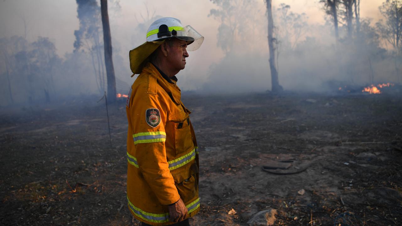 NSW Rural Fire Service volunteer Bob Kneipp successfully defends a property in Torrington, near Glen Innes. Picture: AAP