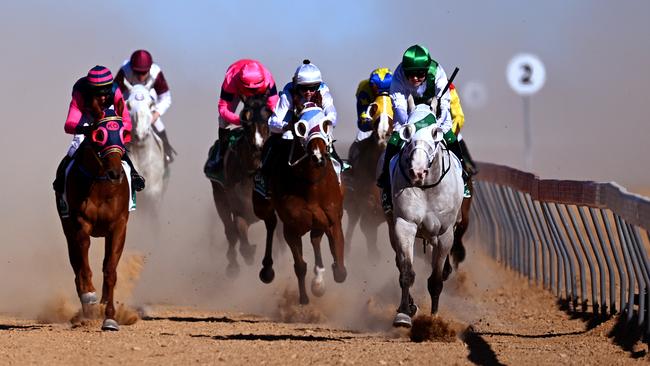 Jockey Emily Finnegan (right) rides the Brook family owned Neodium to win the TAB Birdsville Cup last year. Picture: Dan Peled/NCA NewsWire