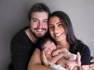 LOVE AND CARE: Rachel and Shea Edwards with their daughter Mia. Mia has a rare brain condition that comes with a life expectancy of seven-10 years. Picture: Sue Louise Photography