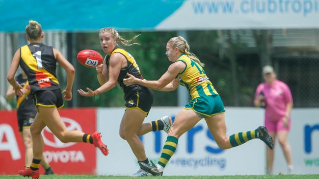 Emily Casey looks to pass under Pressure from Cassie Henderson in the Women's NTFL Round 13: clash, Nightcliff v Pint at TIO Stadium. Picture GLENN CAMPBELL