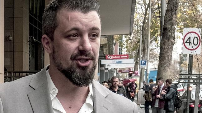 Neil Erikson speaks to media outside the Melbourne Magistrates Court in 2018. Picture: AAP Image/ Luis Ascui