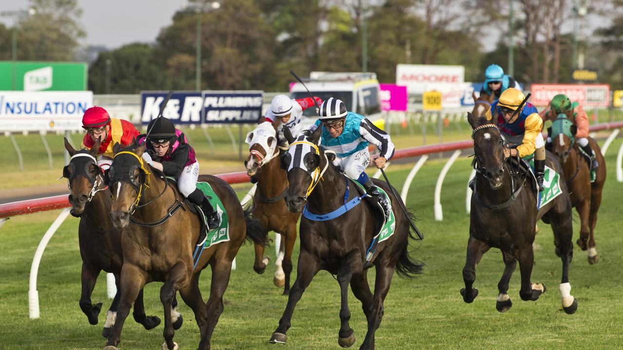 Colpo Di Tamburo ridden by Nick Keal (black cap) edges out Vibrato (outside) to win tonight’s Ratings Band 0-68 Handicap at Clifford Park. Picture: Kevin Farmer