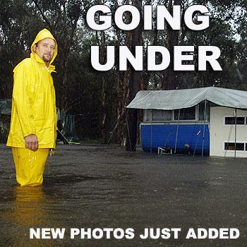 Boreen Point Caravan Park permanent resident Steve Prior watches his home going under water this afternoon. Photo: John McCutcheon.