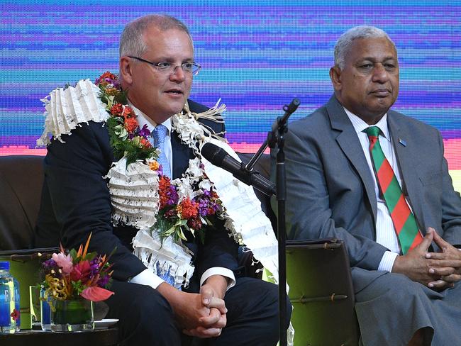 Australian Prime Minister Scott Morrison attends a Traditional Ceremony of Welcome with the Prime Minister of Fiji Frank Bainimarama, in Suva, Fiji, Thursday, January 17, 2019. Scott Morrison is in Fiji to announce significant economic and security partnership with the island nation.(AAP Image/Dan Himbrechts) NO ARCHIVING