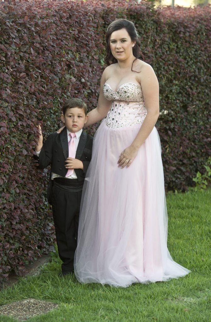 Five-year-old Joshua Bartholomew escorts his older sister Mikaela Harvey. Picture: Nev Madsen