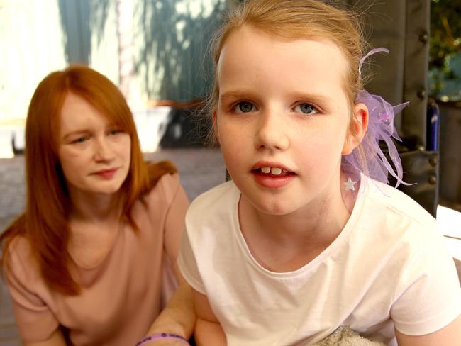 Helen Owen poses for photographs with her daughter Bella, 8 , at their Werrington Downs home on Monday the 30th of October, 2017.Bella suffers from PCDH 19 , an extreme and life threatening type of epilepsy, and has spent 8.5 years of her life in a hospital.