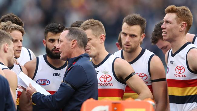 Adelaide coach Don Pyke talks with his players during the Round 19 match against Carlton at the MCG. Picture: AAP Image/David Crosling