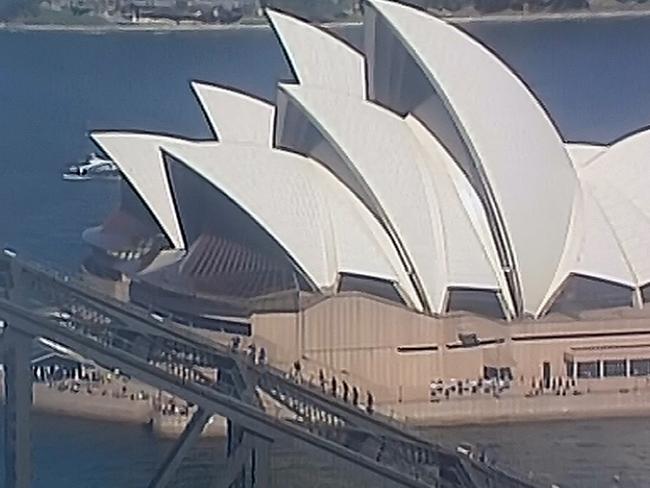 Prince Harry raised the Invictus Games flag at the top of the bridge. Picture: Seven News