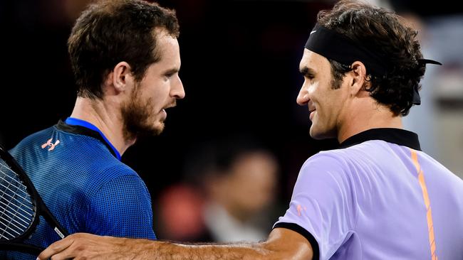 Swiss tennis superstar Roger Federer shakes hands with world number one Britain's Andy Murray.