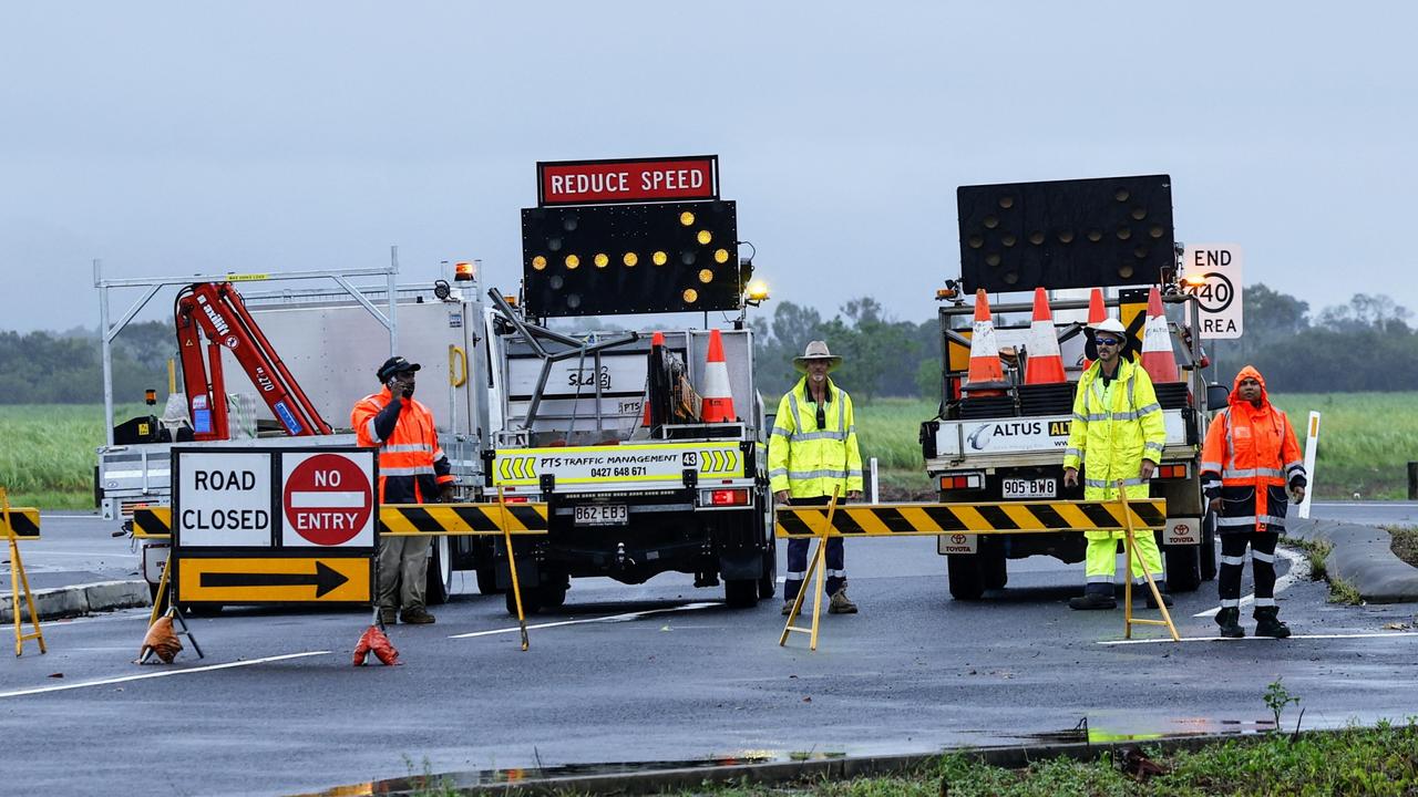 The department of Transport and Main Roads was forced to close the Captain Cook Highway between Holloway's Beach and Smithfield on Thursday after heavy rain swelled Thomatis Creek, pushing flood water and debris over the road. Picture: Brendan Radke